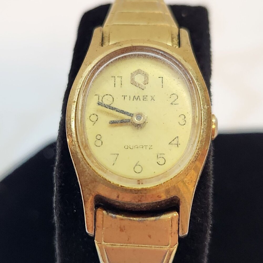 Vintage Q Timex Quartz TimexKcell Gold Tone Stretch Wrist‎ Watch Analog Numbers